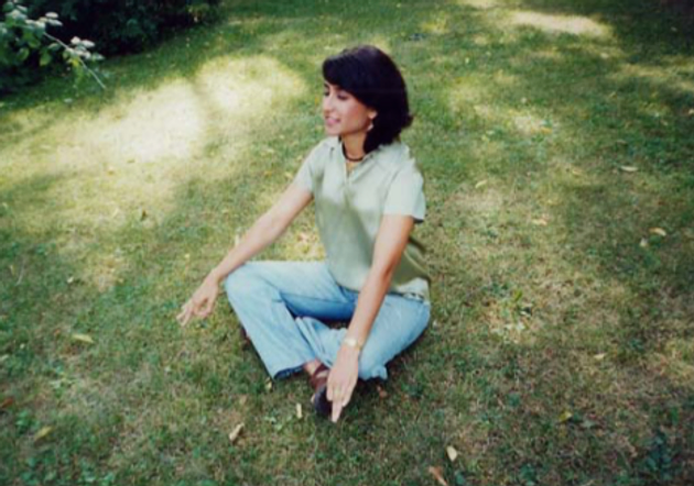 Rachana Rajendra meditating on grass